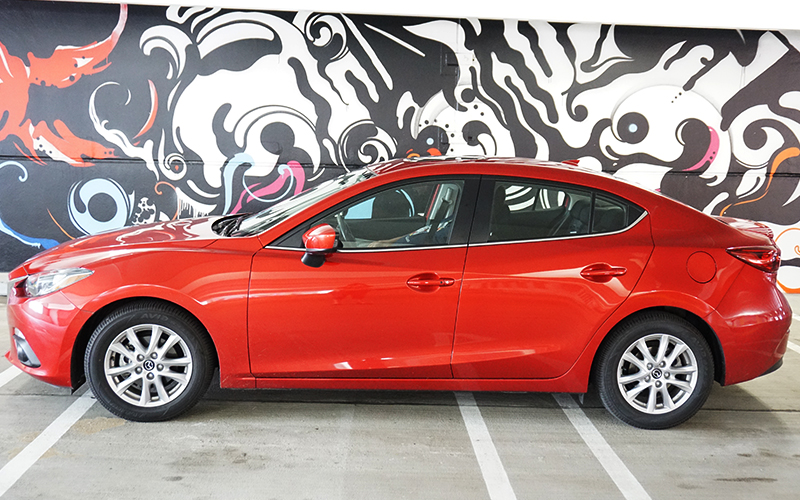 Car in front of a mural at the Z Lot Parking Garage in Detroit. Who would have thought art would be in parking garages?