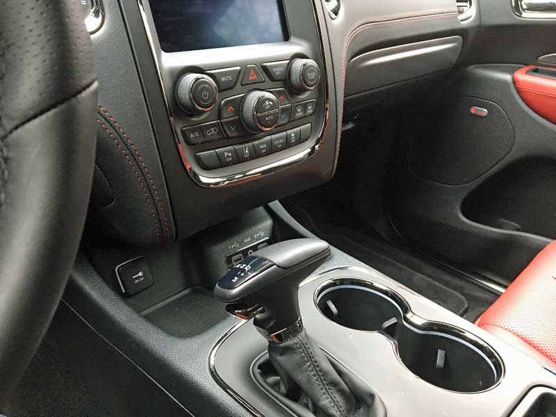 The Dodge Durango has a nice amount of space under the dash for phones, sunglasses, etc. And easy access to USB ports!