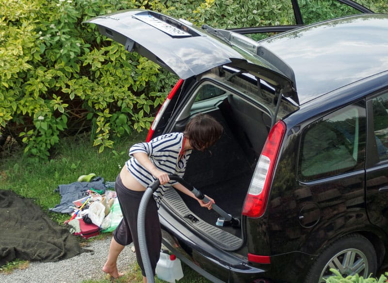 woman cleaning to KonMari your car