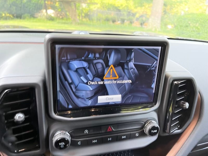 An image of the rear seat with a child's car seat is an emphatic reminder to check the rear seats when you leave the car prevent heatstroke and hot car deaths