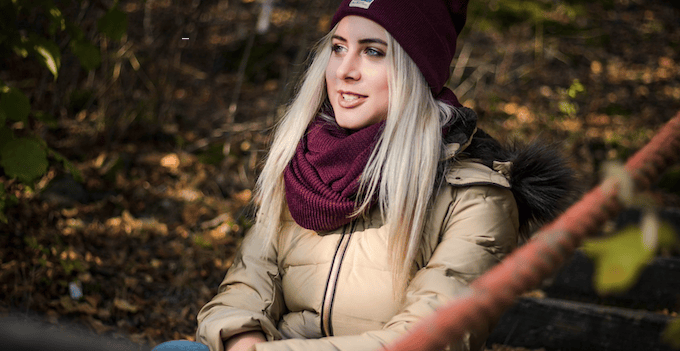 Girl looks on at autumn scenery