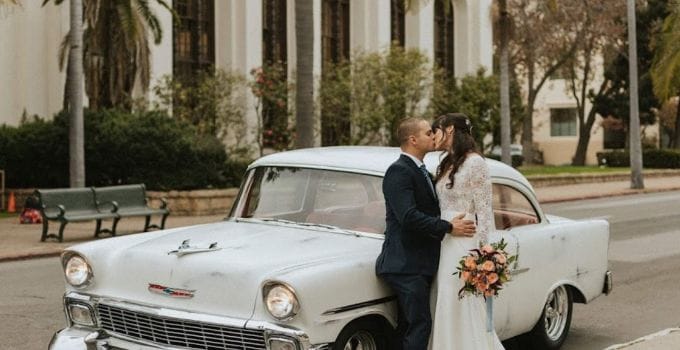 1956 Chevy Belair with beautiful couple standing beside it