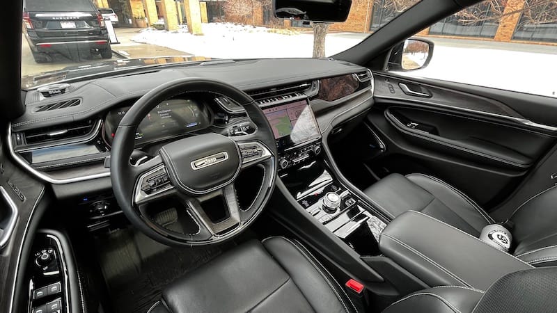 The interior looks sporty and upscale with wood trim along with contrast stitching and silver details. Photo: Sara Lacey