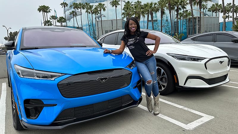 A Blue Mustang Mach-E And A White - This Is A Great Road Trip Car