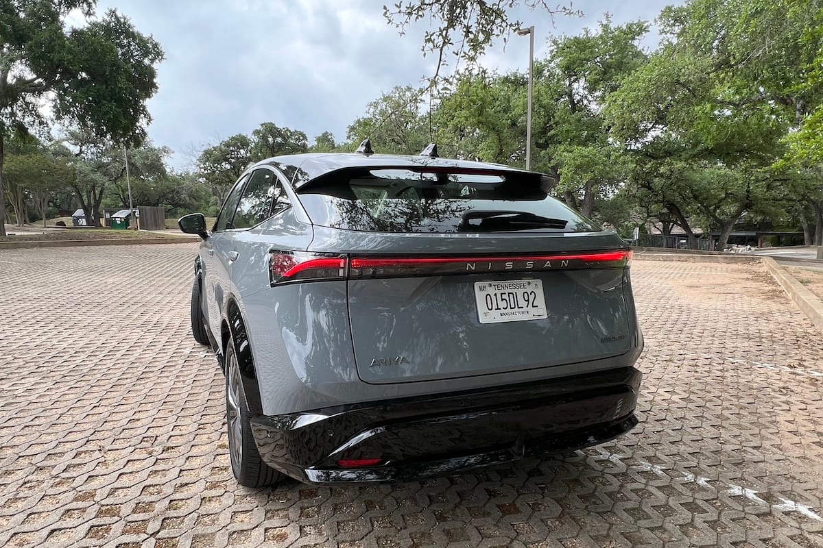 The Rear Of The Nissan Ariya Features A Light Bar Above The Nissan Name