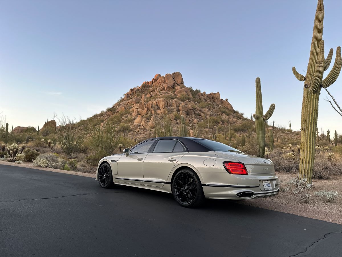 The 2025 Bentley Flying Spur Speed Parked Next To A Picturesque Desert Landscape