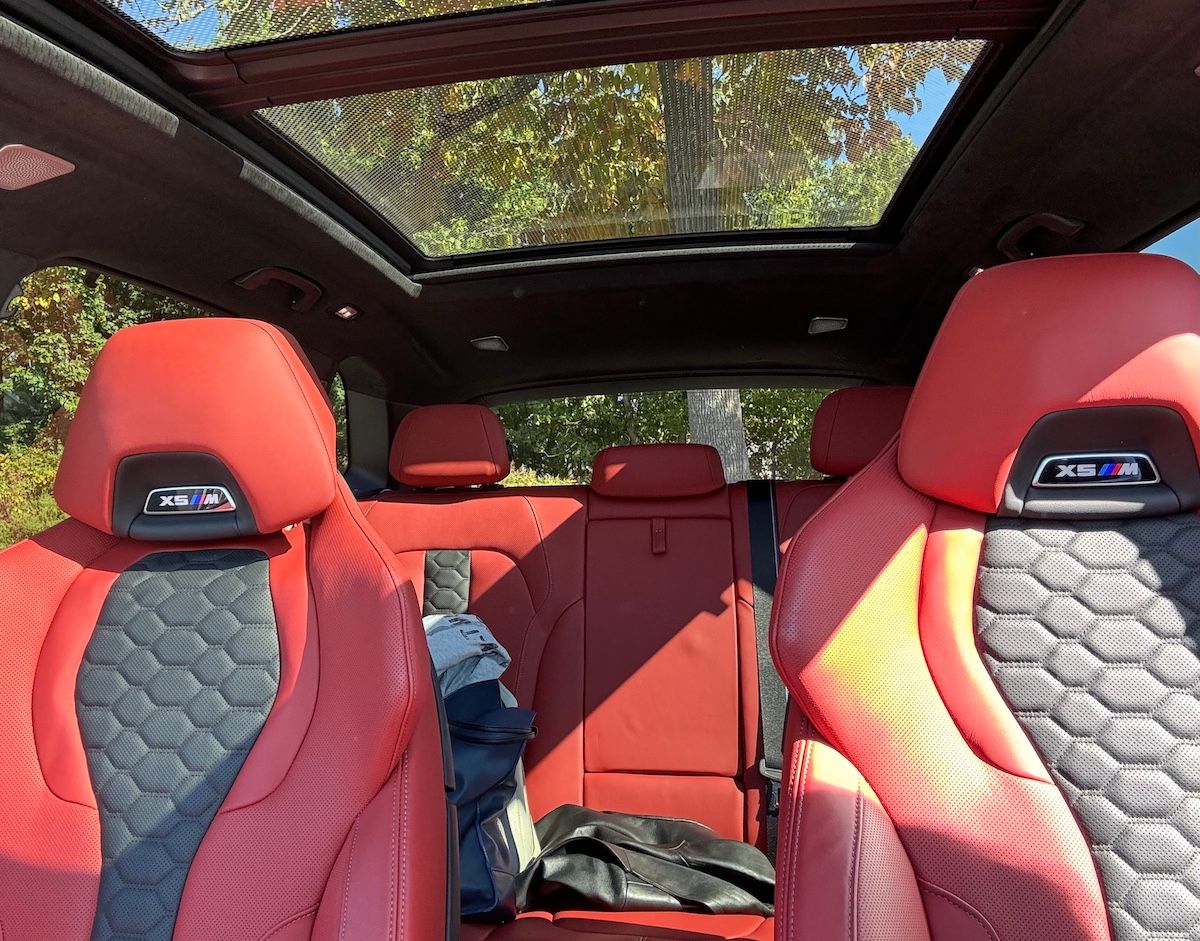 The Interior Of The 2024 Bmw X5 M Is Illuminated By The Panoramic Sun Roof
