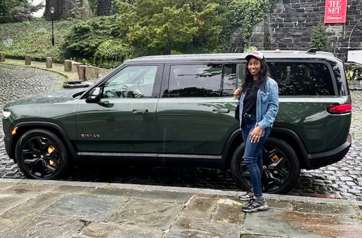 Standing next to the R1S at The Met Cloisters after our drive from Manhattan even on a rainy day