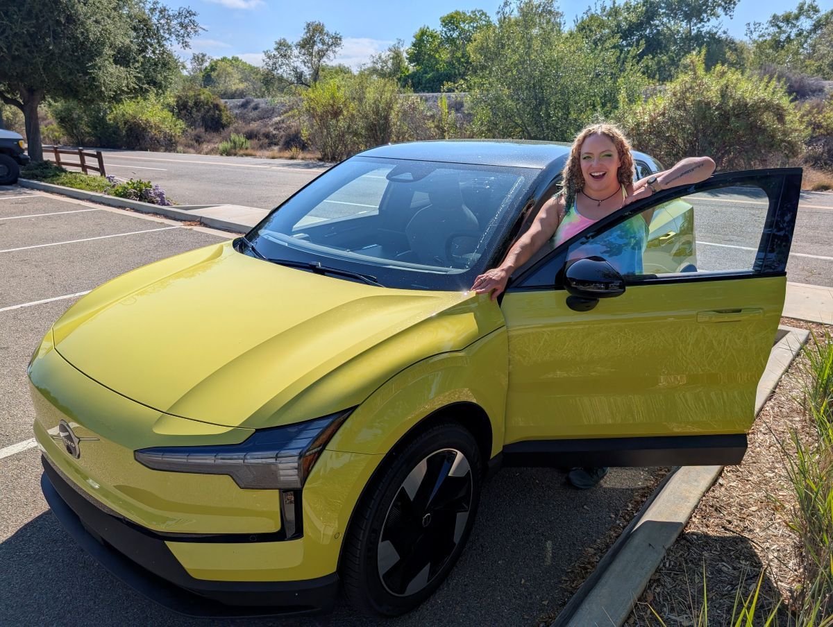 Liv standing with the 2025 Volvo EX30 in Moss Yellow