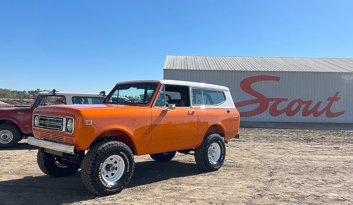A heritage Scout stands on the building site of the new assembly plant.