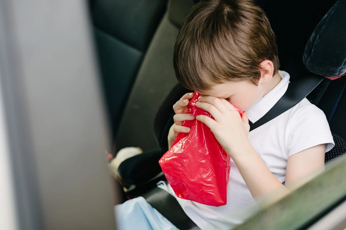 Car sick child clean puke out of a car