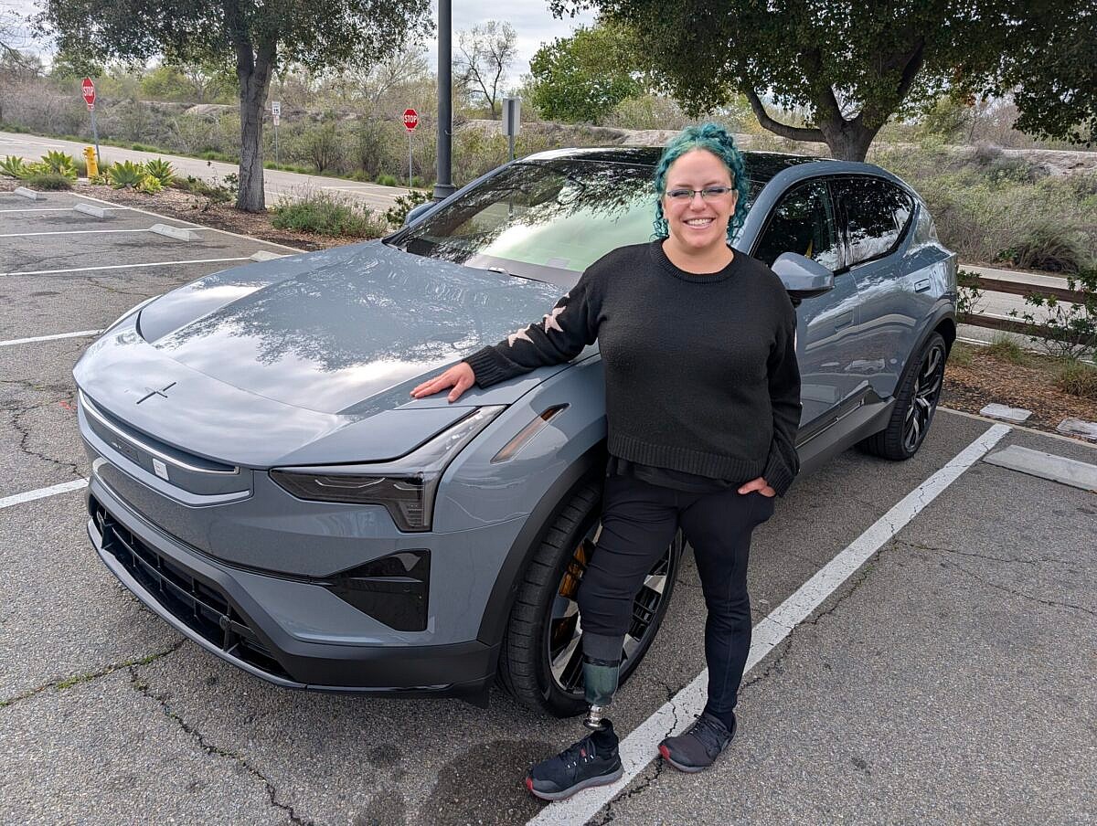 Liv Leigh standing next to a Polestar 3