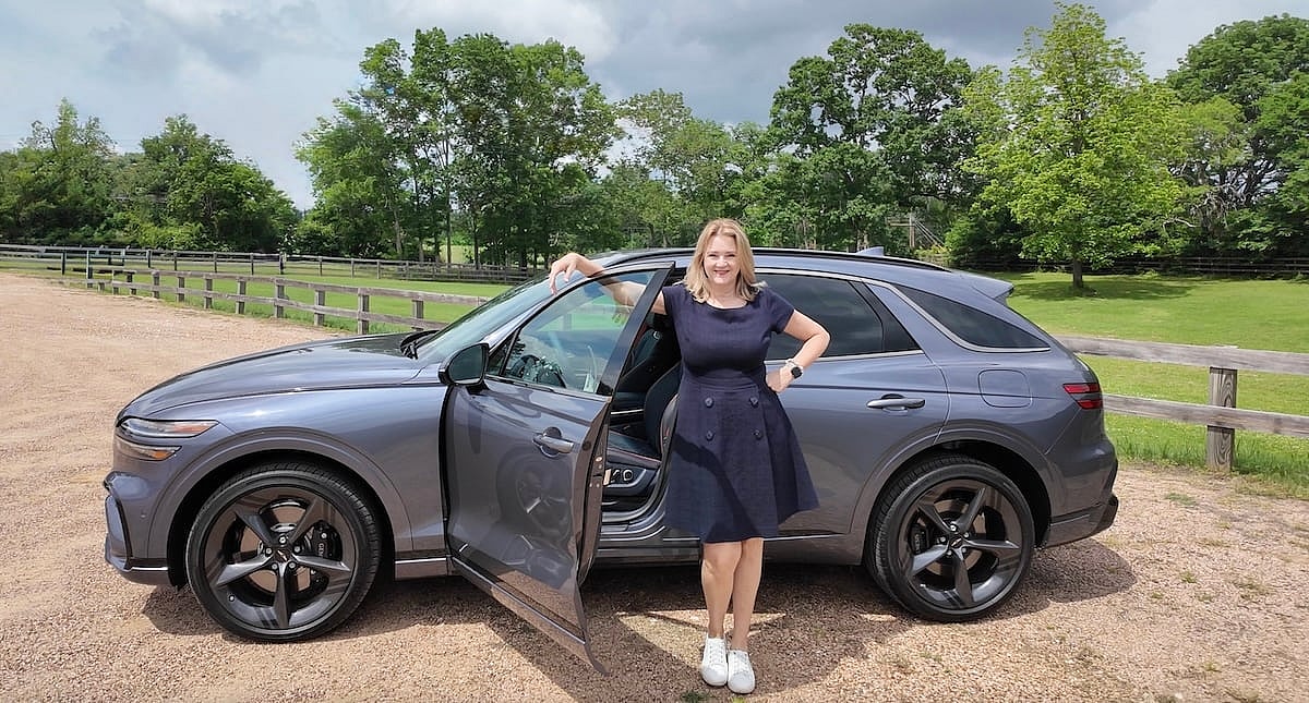 2026 Genesis GV70: Subtle Design Changes and a Big Tech Upgrade Enhance This SUV's Luxury 11 A well earned smile after a day of driving the Genesis GV70