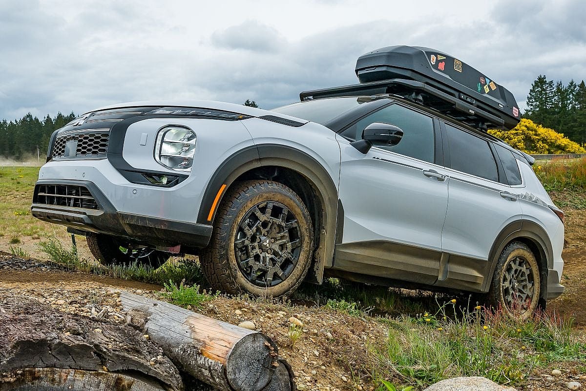 5 Reasons We're Stoked About the 2025 Mitsubishi Outlander Trail Edition 9 The 2025 Mitsubishi Outlander Trail Edition climbing a muddy hill
