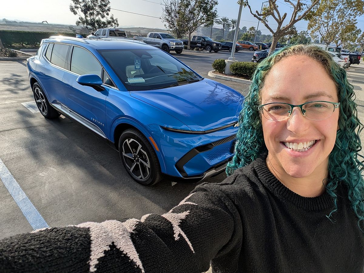 Liv and her Equinox EV nicknamed "Aquanox"