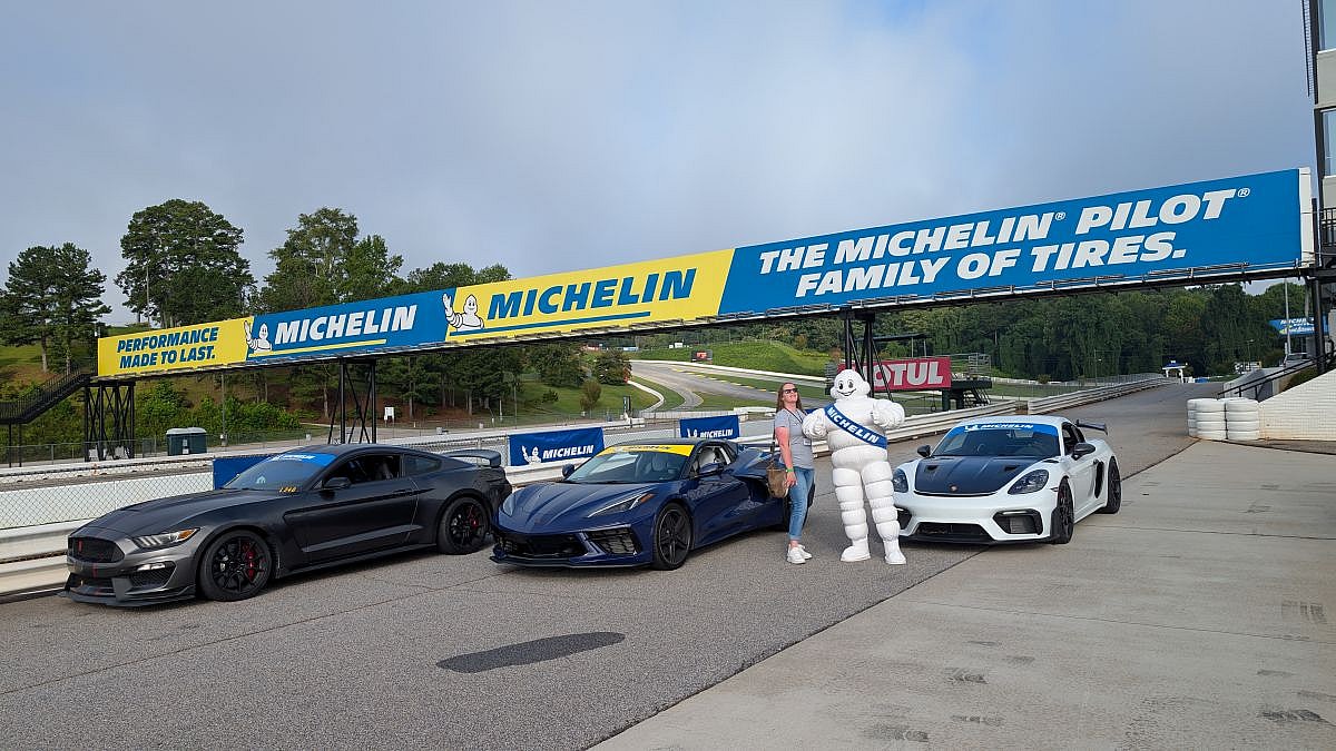 Are All-Season and All-Weather Tires the Same? Turns Out, No. How to Tell What You Need, By Car Type and Conditions 10 Me standing next to Bib the Michelin tires Man in the Pit Lanes of Michelin Roadway Atlanta