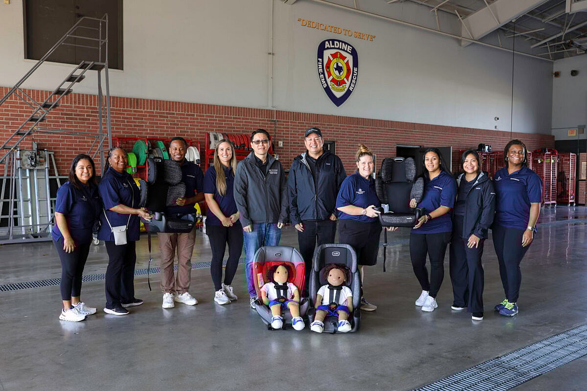 The crew at the Aldine Fire and Rescue in Houston that helped educate visitors on how to install car seats safely, and handed out free car seats as part of the Hyundai Hopes and Genesis Gives events