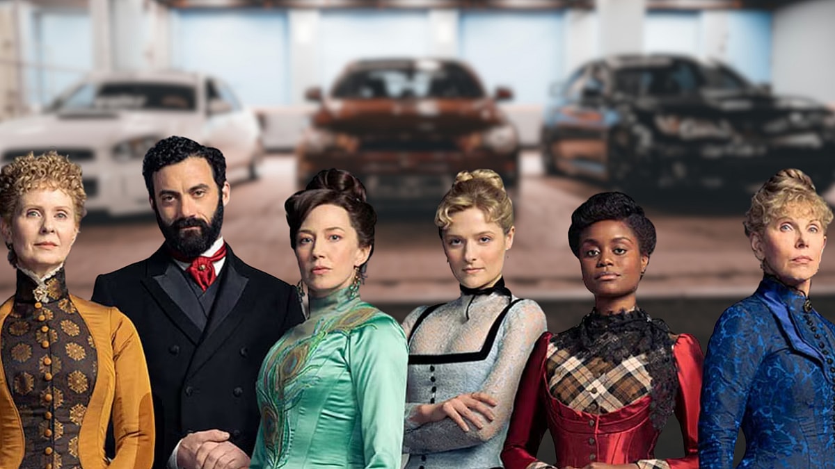 What Would the Characters of The Gilded Age Drive if They Could? 7 The cast of The Gilded Age standing in front of a garage