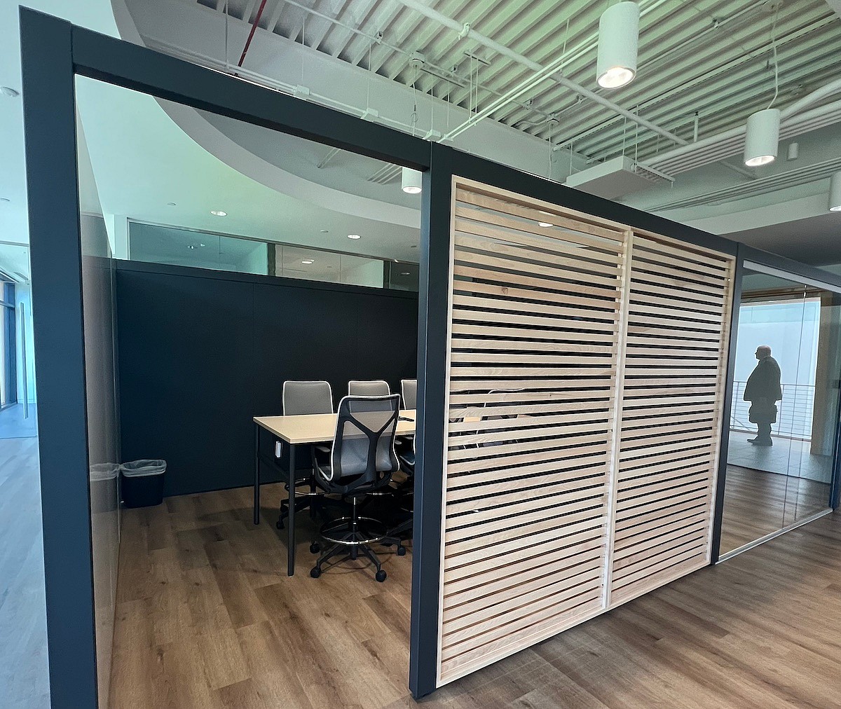 A Semi-Private Feeling Is Created For This Meeting Room With An Open Top And A Louvered Wall