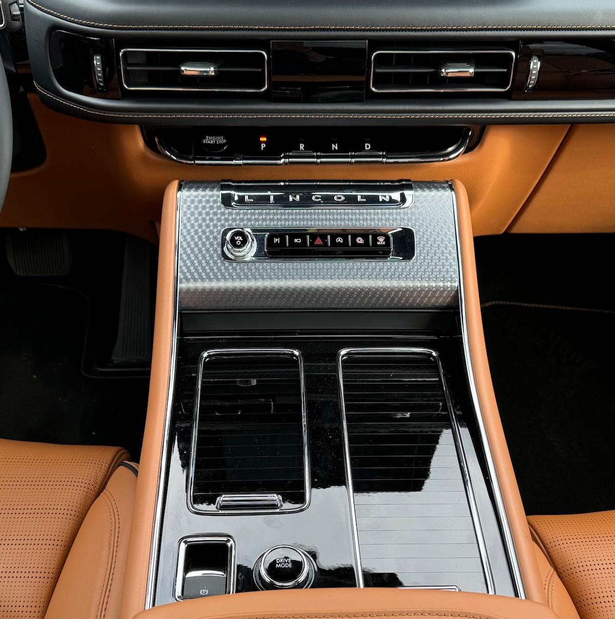 The Center Console Has Retractable Covers And A Button Gear Selector In The Lincoln Aviator