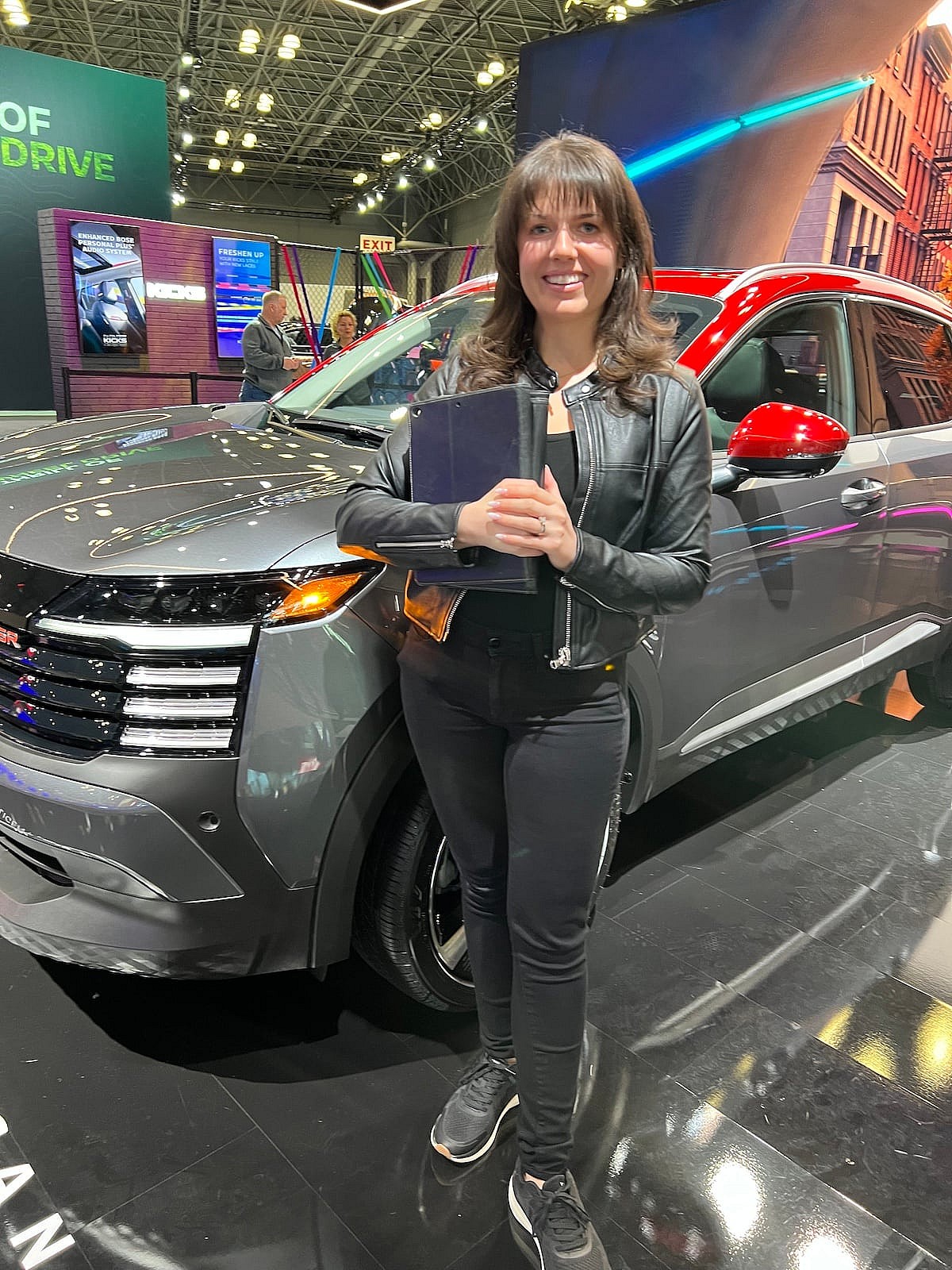 This Nissan Product Specialist Is In A Spanx Leather Jacket And Paige Jeans At Car Shows