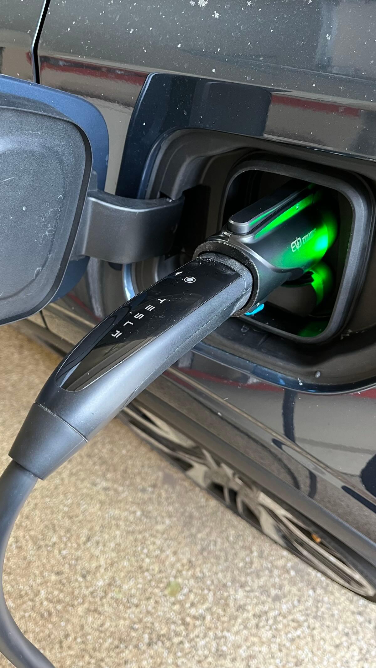 Tesla Connector With Adapter Attached, Charging A Polestar 2. Photo: Sara Lacey