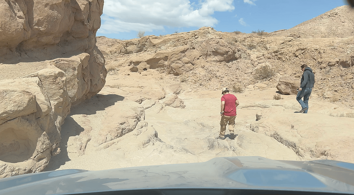 Crawling Through A Tight Spot Between Large Rocks