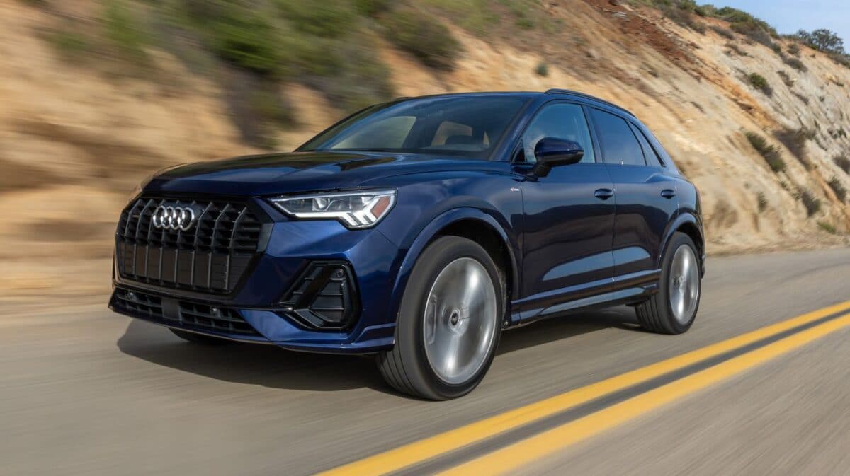 A 2025 Audi Q3 Driving Down A Highway