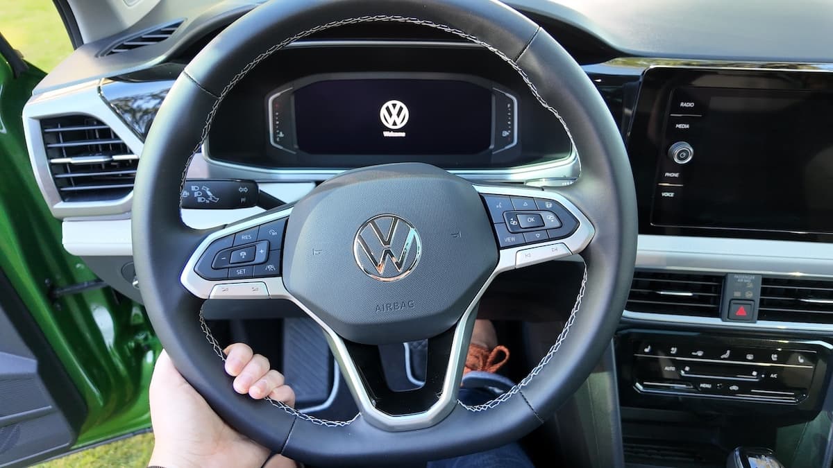 2025 VW Taos: Surprisingly Spacious and Tech-Forward—and Not Surprisingly, Fun to Drive 7 A Girls Guide To Cars | 2025 Vw Taos: Surprisingly Spacious And Tech-Forward—And Not Surprisingly, Fun To Drive - 2025 Vw Taos Front Cabin Steering Wheel Up Close Natalie Merola A Girls Guide To Cars