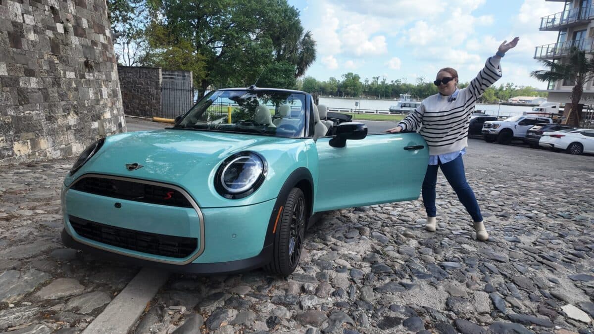 Natalie Standing Next To The New Mini Cooper S Convertible