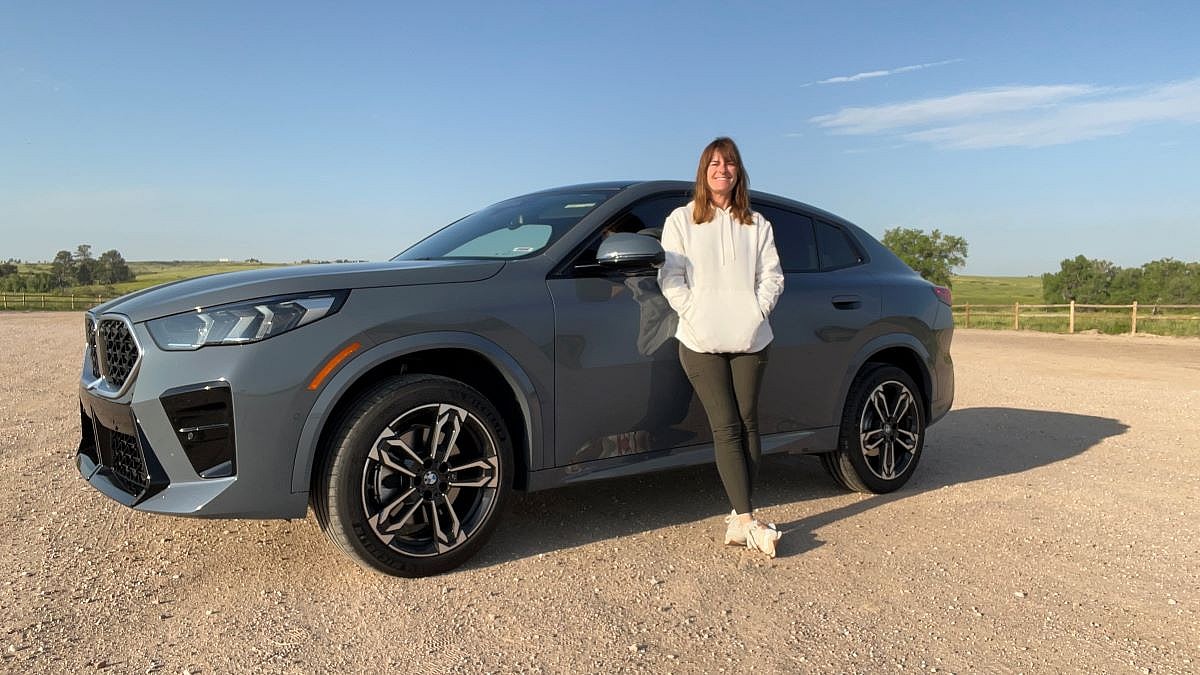 Sara Lacey Standing Next To The Bmw