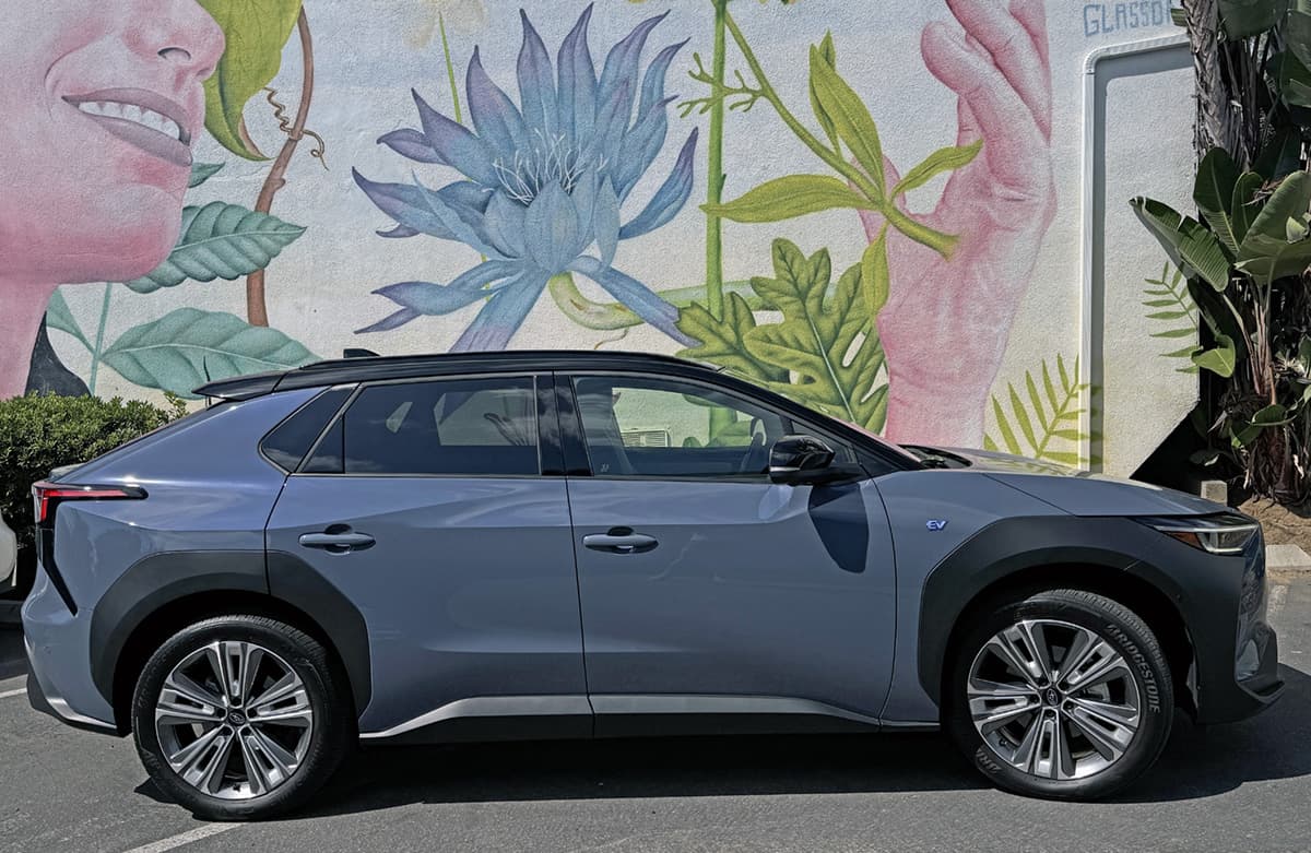 The 2024 Subaru Solterra Next To A Floral Mural