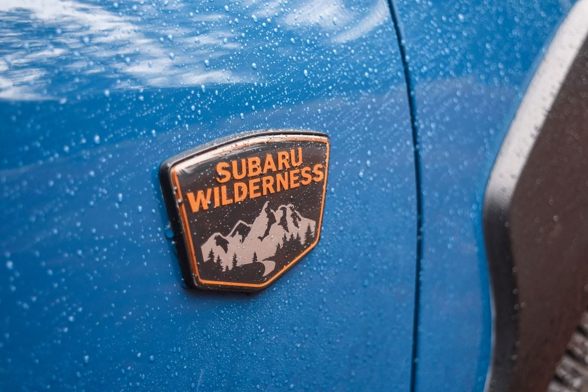A Subaru Wilderness on the Subaru Crosstrek accented by rain drops
