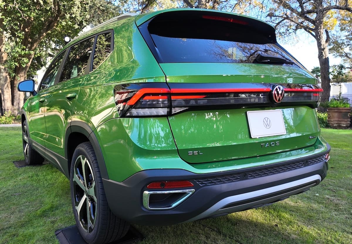 2025 VW Taos: Surprisingly Spacious and Tech-Forward—and Not Surprisingly, Fun to Drive 4 A Girls Guide To Cars | 2025 Vw Taos: Surprisingly Spacious And Tech-Forward—And Not Surprisingly, Fun To Drive - 2025 Vw Taos Back End Bright Moss Green Natalie Merola A Girls Guide To Cars