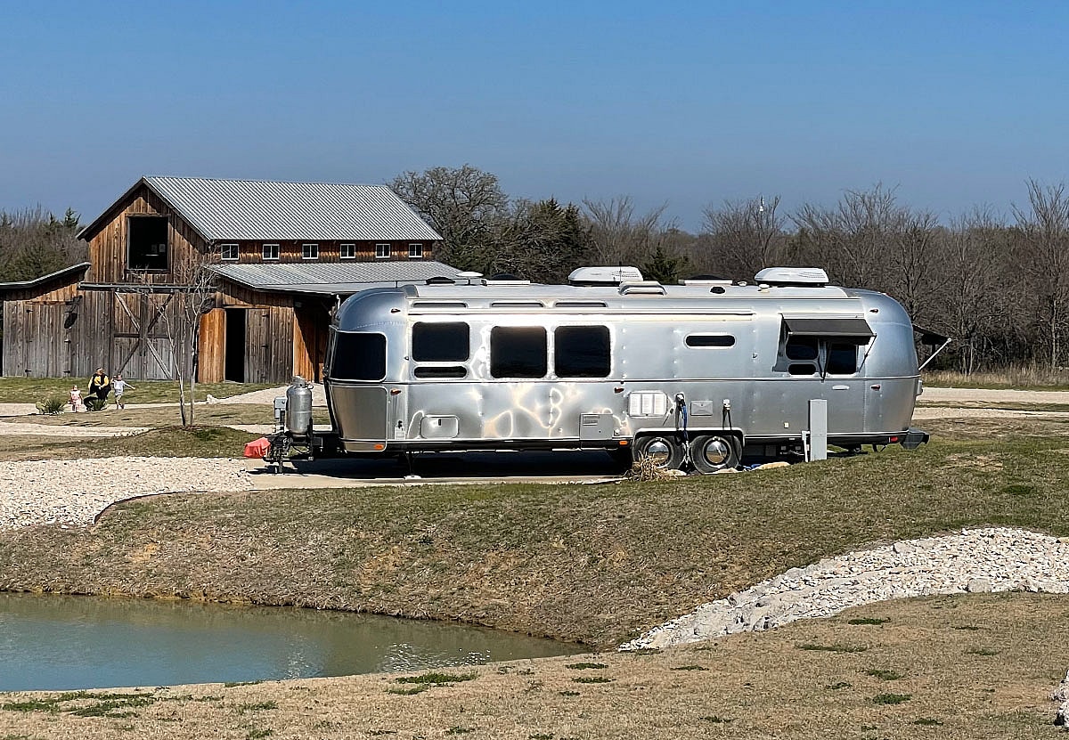 A Girls Guide To Cars | Find Yourself Pining For Adorable, Instagramable Travel In An Airstream? - Trade Wind Travel Trailer At Campground