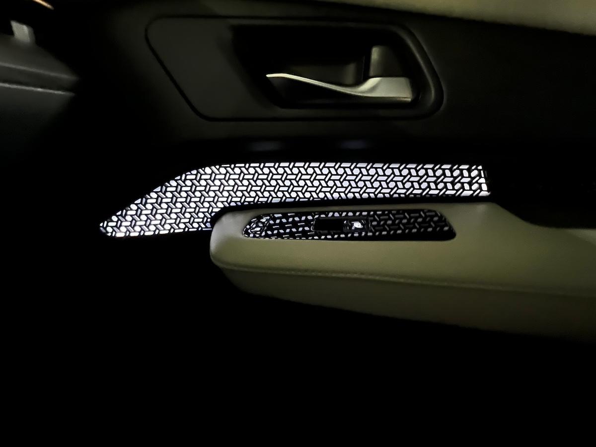 The Nissan Ariya Might Seriously Be the Most Beautiful Nissan, Ever. 5 This Mesh Panel Lights Up The Door Panel In The Nissan Ariya