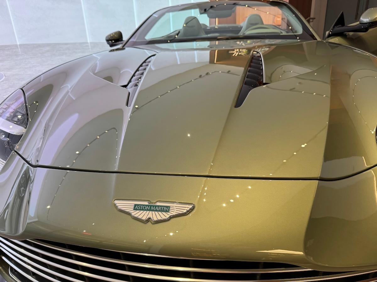 The Front Hood And Badge On The Aston Martin Vanquish Volante