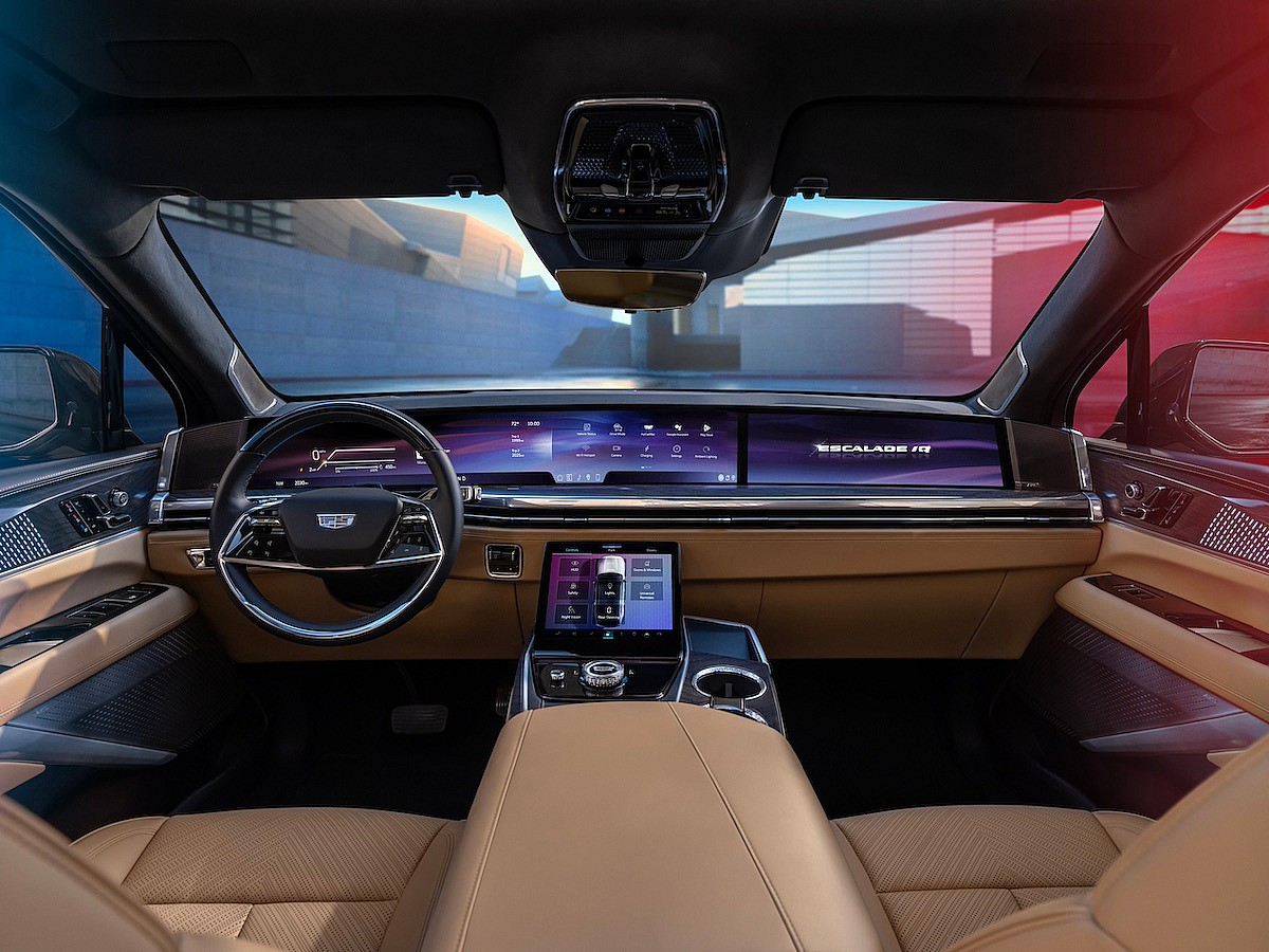 Forward-Facing View Of Cadillac Escalade Iq Interior And 55-Inch Pillar-To-Pillar Screen From The Rear Seat.