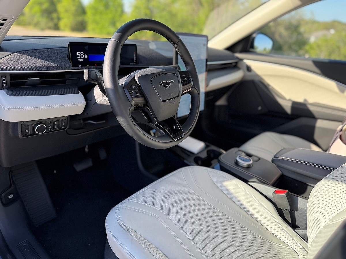 The Center Console Of The Ford Mustang Mach-E With All My Stuff