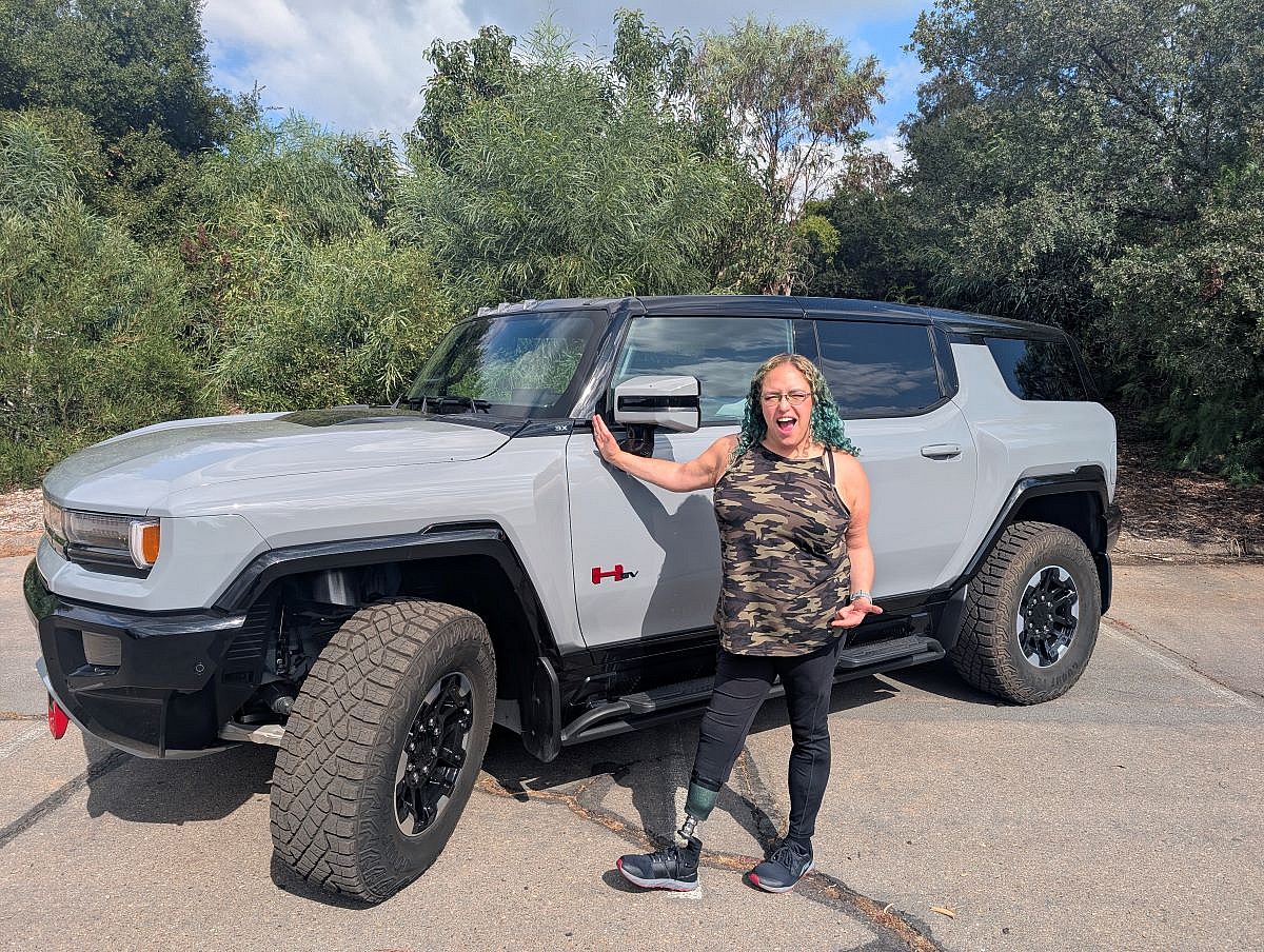 Liv Leigh Standing Next To The 2025 Gmc Hummer Ev 3X Suv