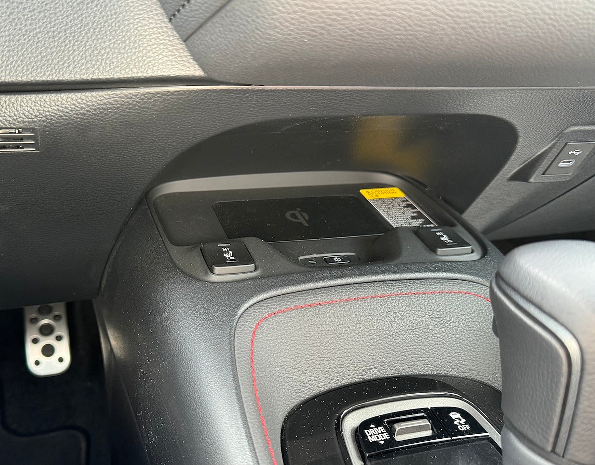 The Wireless Charger Is Tucked Under The Console And Holds A Phone Securely In The Toyota Gr Corolla Dat