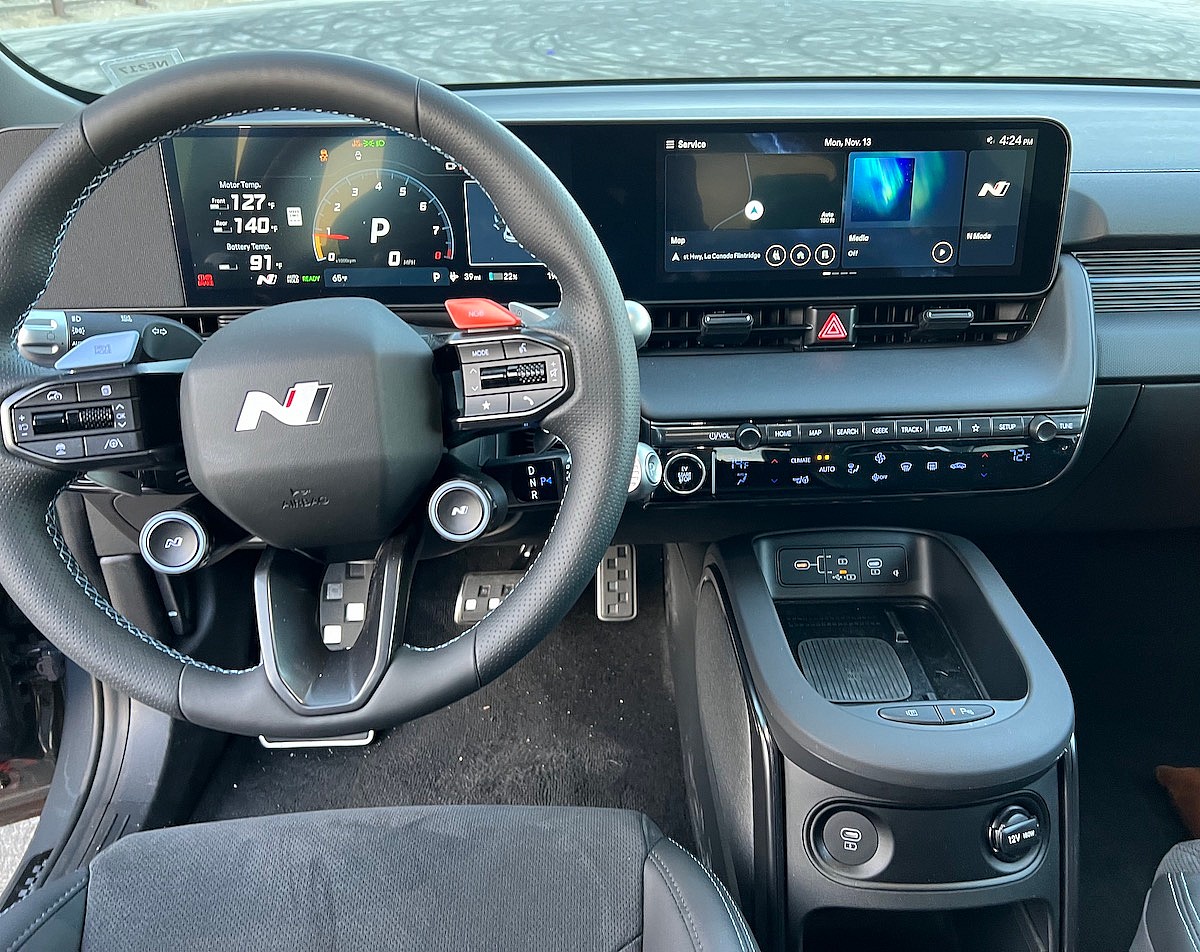 The Most Interesting Steering Wheel, And A Center Console Designed To Keep Things From Flying Around The Cabin