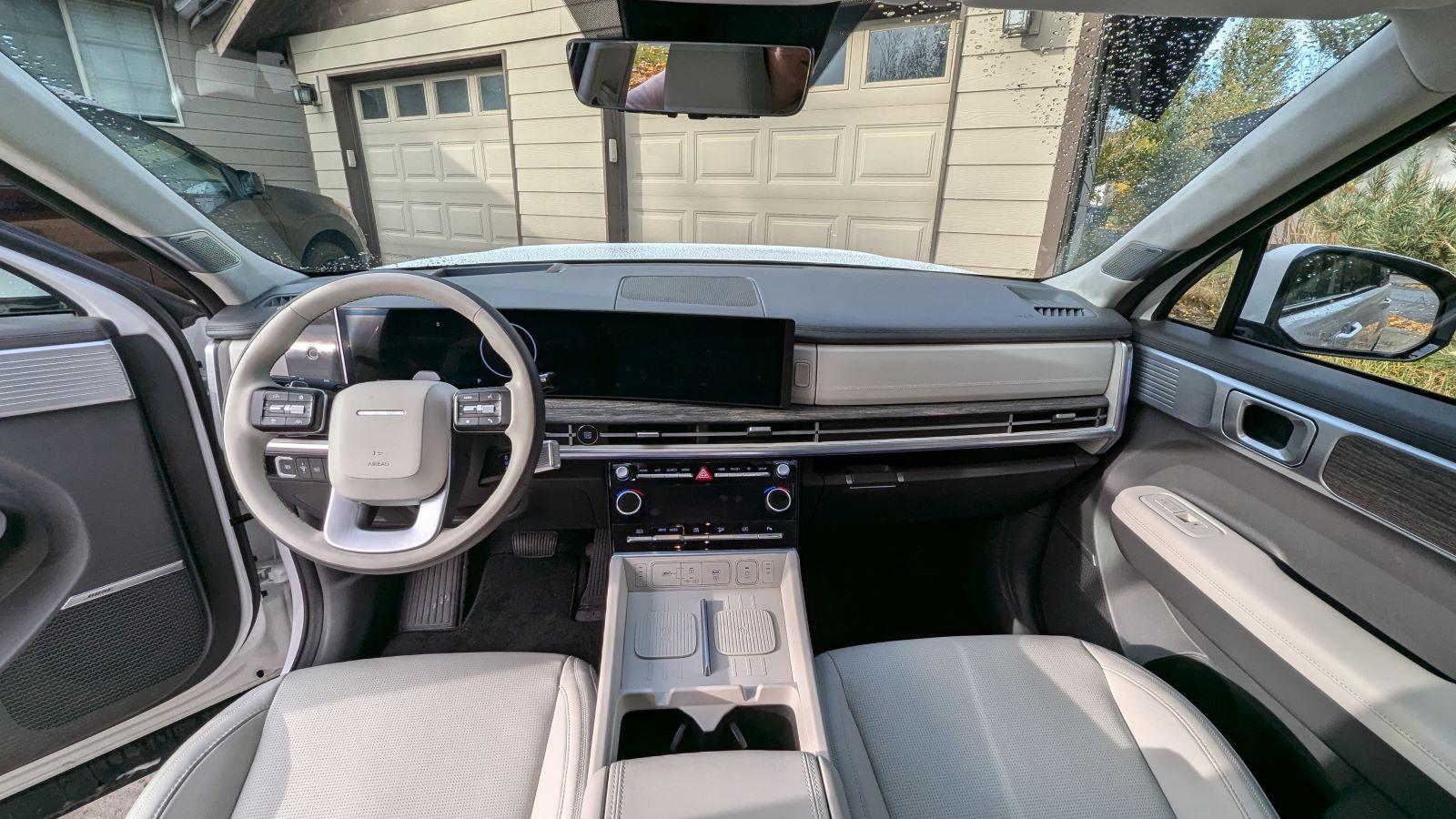 The Interior Of The 2024 Hyundai Santa Fe Calligraphy Hybrid Model, Pictured From The Center Of The Rear Seats