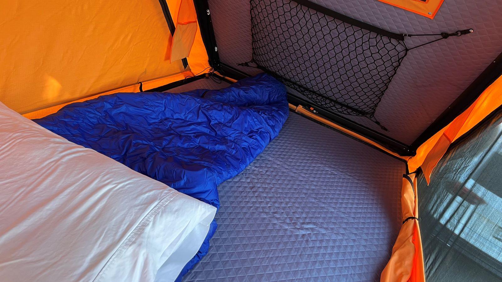The Inside Of The Taxa Woolly Bear Camping Trailer, Which Featured A Small Foam Mattress For Three People