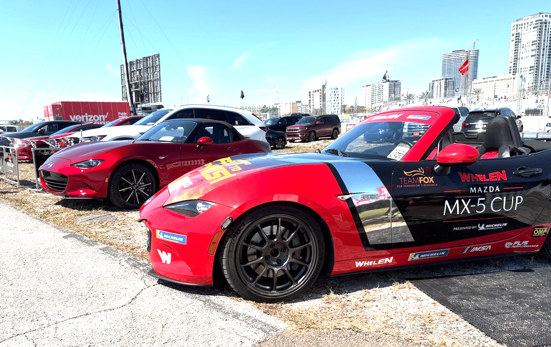 These Women, and the Mazda Miata MX-5, Are Changing the Face of Racing in 'First to the Finish' 8 A Standard Mazda Miata Mx-5 And A Promotional Car To The Left Of It