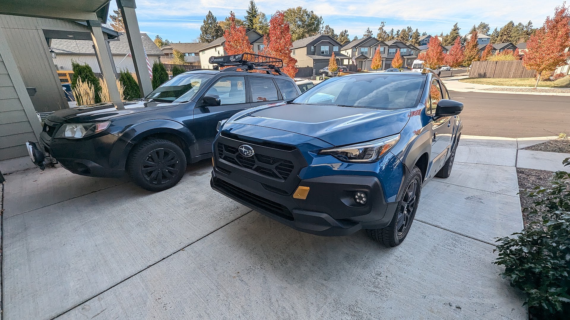 The 2024 Subaru Crosstrek Wilderness Parked Next To A 2011 Subaru Forester