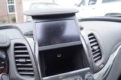 This Secret Compartment Behind The Touch Screen Lets You Plug And Stow Your Phone. No Risk Of Texting While Driving. Also, It'S A Good Place To Hide Your Chocolate From Hershey.
