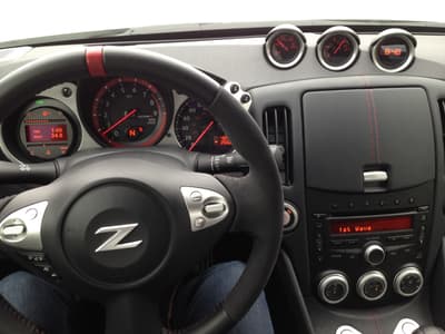 A Cabin Outfitted With Just What You Need: Controls On The Steering Wheel Allow Hands Free Phone And Easy Radio Tuning; Gauges Are Neatly Displayed.