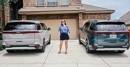 Me Standing With Both Of Our Minivans