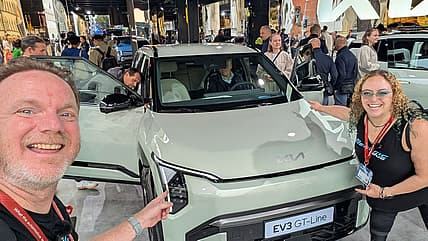 What Does the Future of Cars Hold? We Checked out 2025 IAA Mobility Expo and This is What's In Store 2 Patrick Anderson And Liv Leigh With A New Kia Ev At The Iaa Mobility Expo